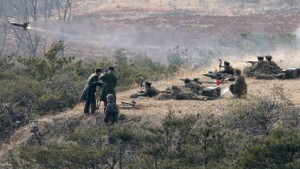 In this image released Monday, Feb. 25, 2013, by the Korean Central News Agency (KCNA) and distributed Tuesday, Feb. 26 by the Korea News Service, a Korean People's Army artillery unit participate in a live fire drill while North Korean leader Kim Jong Un, unseen, inspects the unit at an undisclosed location,  in North Korea. (AP Photo/KCNA via KNS) JAPAN OUT UNTIL 14 DAYS AFTER THE DAY OF TRANSMISSION