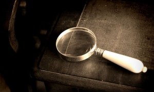 magnifying-glass-and-closed-book-590x390