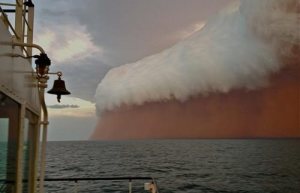Handout shows a cloud formation tinged with red dust travelling across the Indian Ocean near Onslow on the Western Australia coast